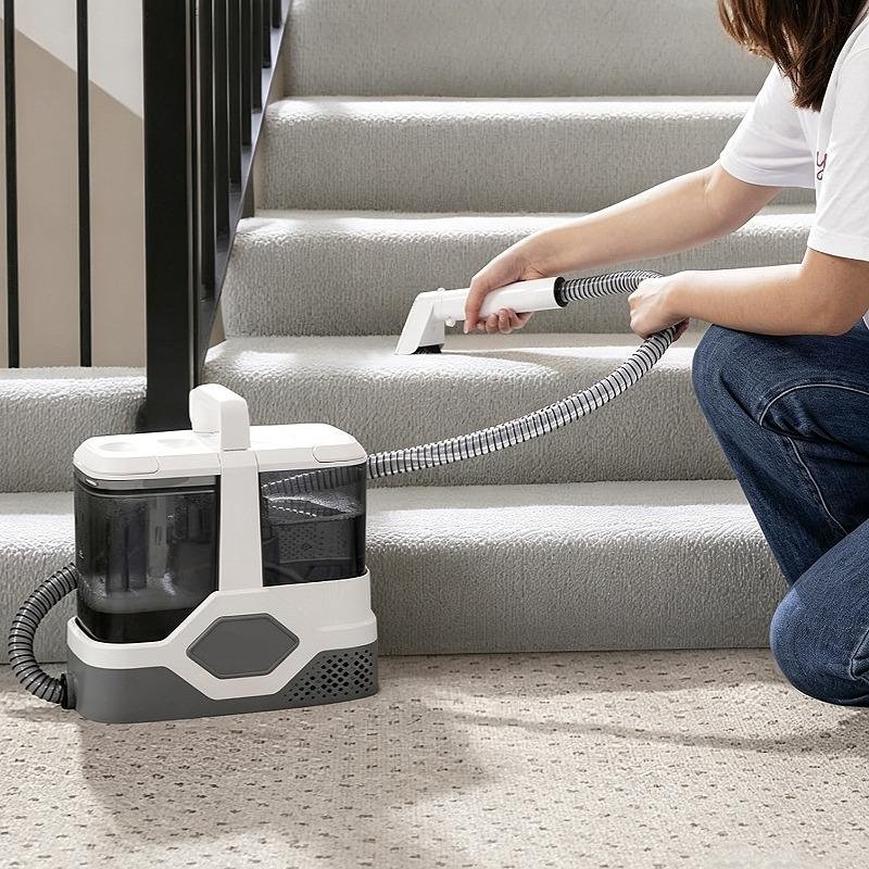 Compact cleaner tackling carpeted staircase effectively